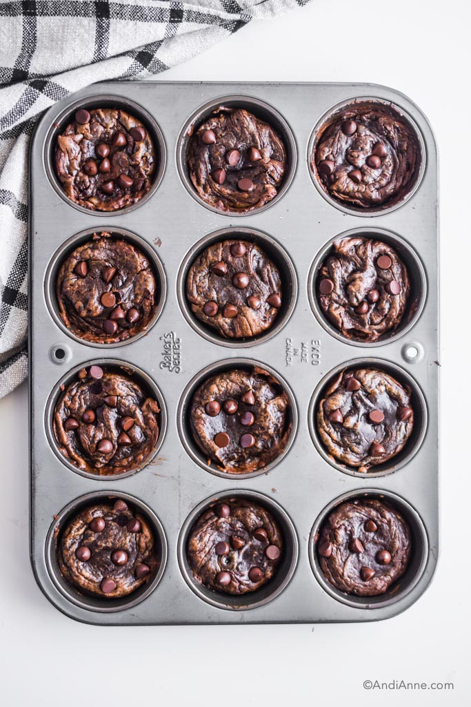 cooked flourless chocolate banana muffins in a muffin pan