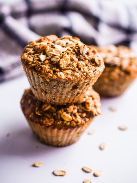 banana oatmeal muffins stacked on top of each other