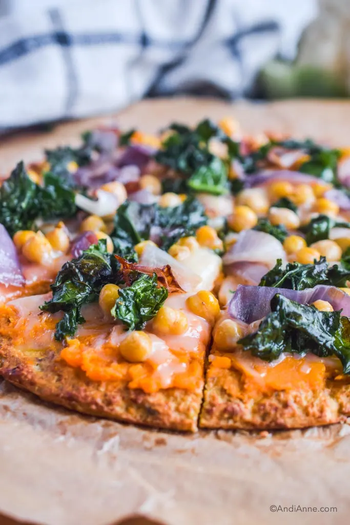 close up detail of side of kale chickpea cauliflower pizza