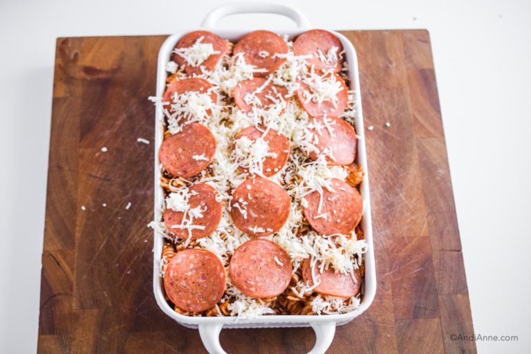 sliced pepperoni on top of pizza pasta bake