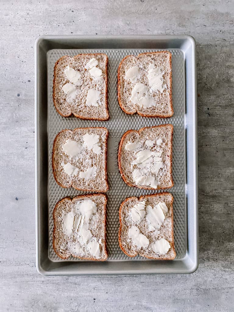 buttered bread on a sheet pan