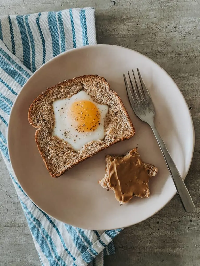 Baked Eggs In A Hole recipe on plate with fork