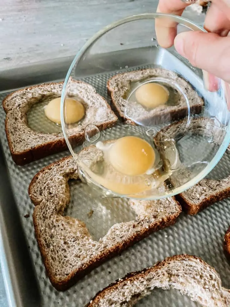 pouring raw egg in to center of bread