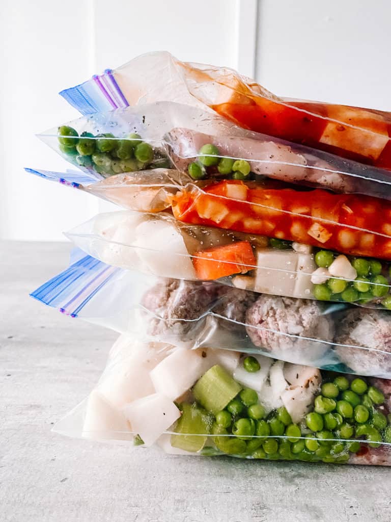 crockpot freezer meals recipes stacked in ziploc freezer bags