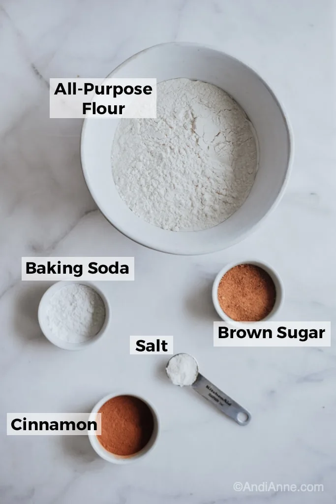 ingredients in white bowls on a marble counter