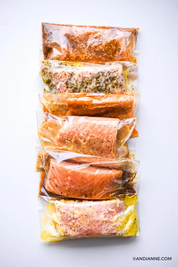 salmon marinades in plastic bags stacked beside eachother