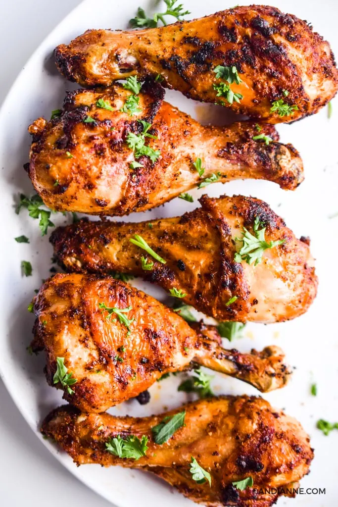 air fryer chicken drumsticks on a white plate