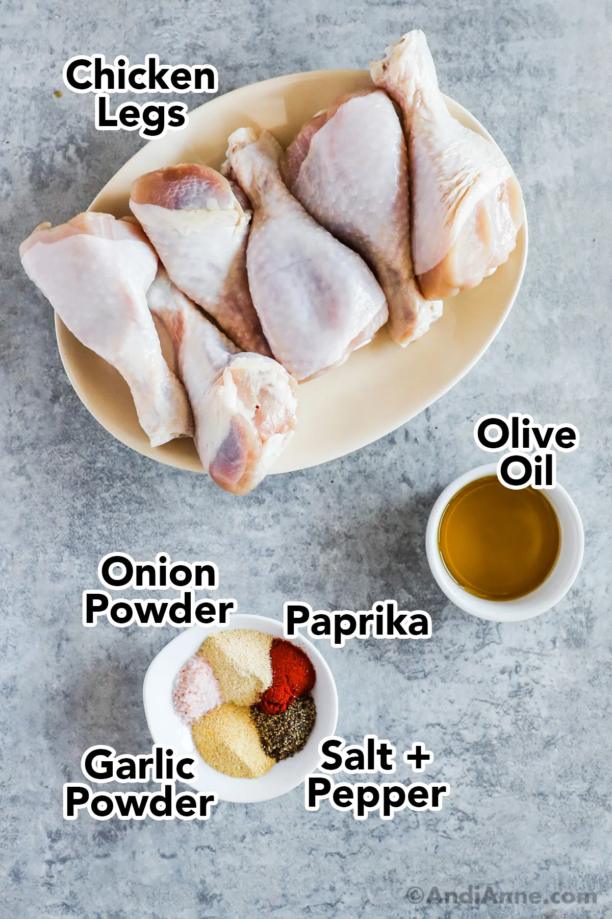 A plate of raw chicken drumsticks, bowl of olive oil, and small bowl with various spices.