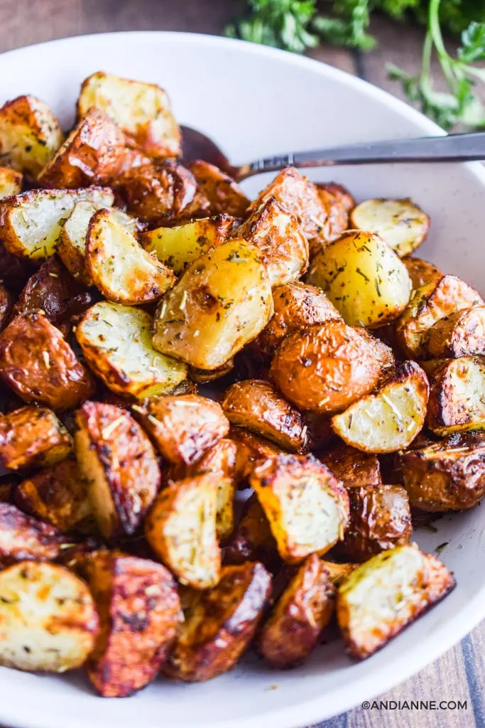 air fryer crispy potatoes in a white bowl