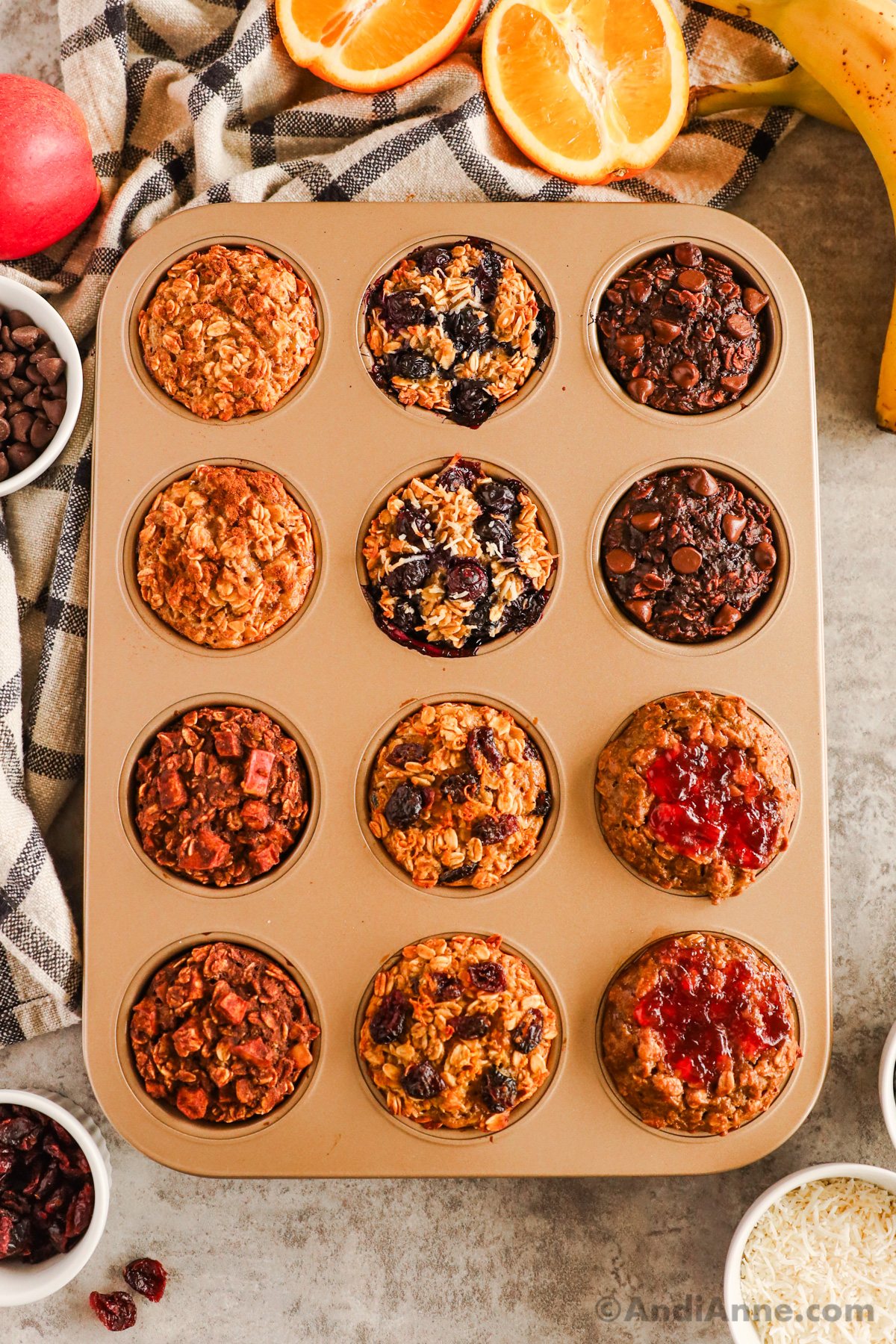 A muffin pan with baked oatmeal cups in various flavors.