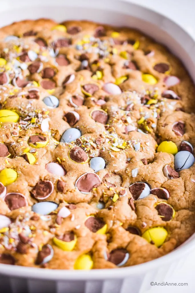 close up detail of crushed eggs on top of blondie in white dish