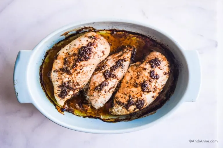 3 cooked chicken breasts in blue oval baking dish