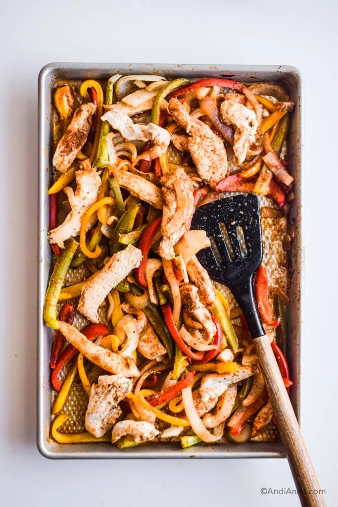 chicken fajita sheet pan meal with spatula