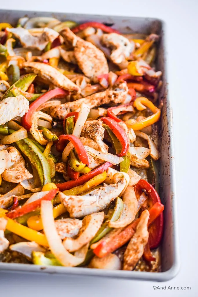 close up detail of sheet pan fajitas after they're cooked on the baking sheet