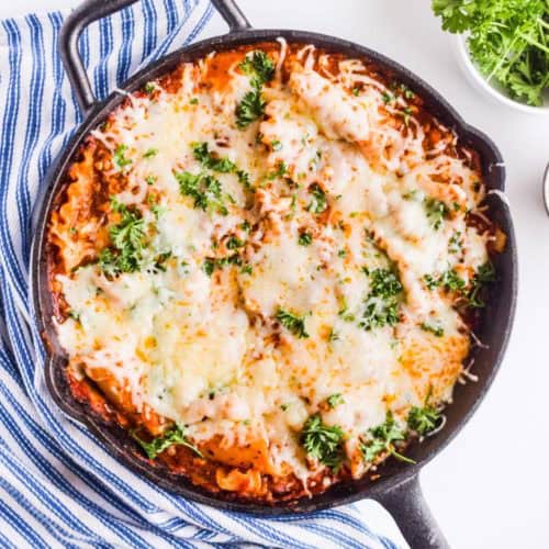 A skillet with baked lasagna.