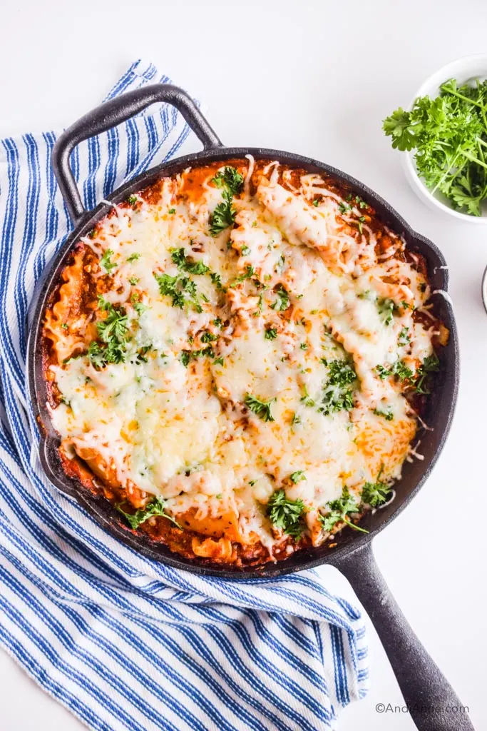 A skillet with baked lasagna.