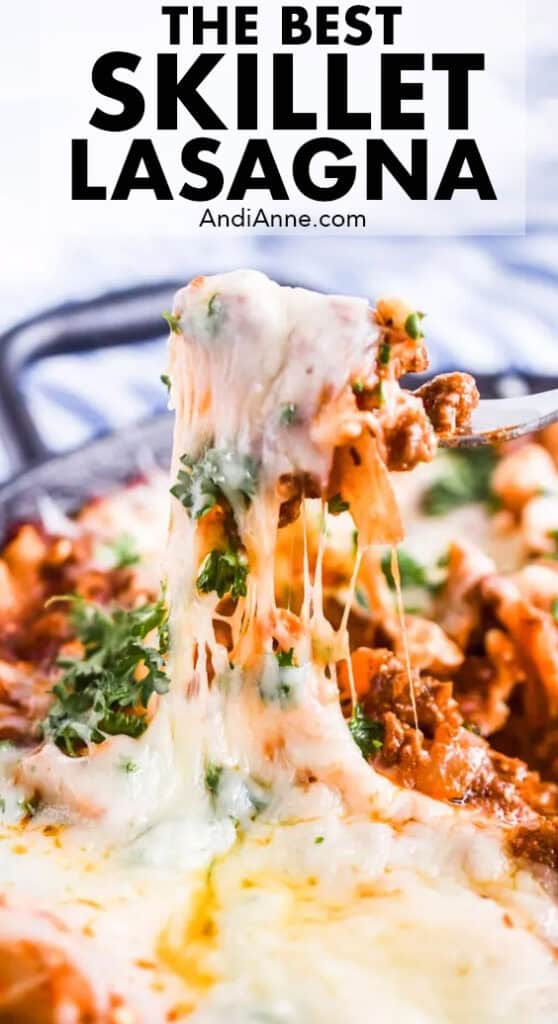 A fork pulling melted cheese from skillet lasagna recipe