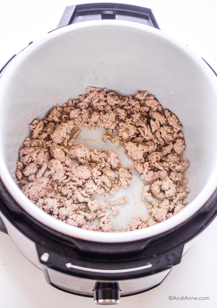 ground turkey cooking inside an instant pot with lid off