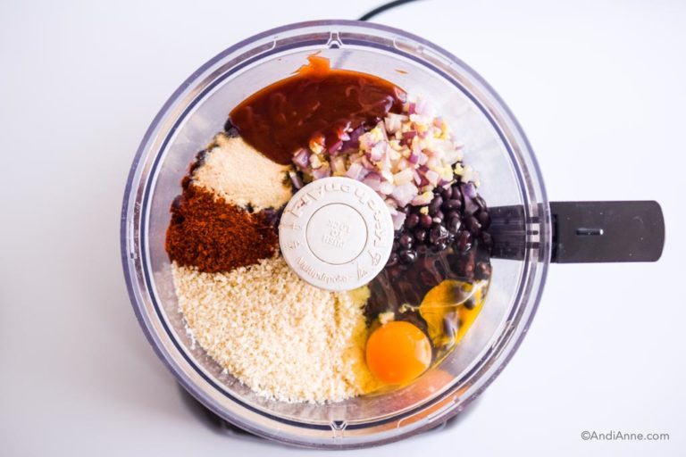 all ingredients including eggs, beans, barbecue sauce, spices and panko crumbs inside a food processor