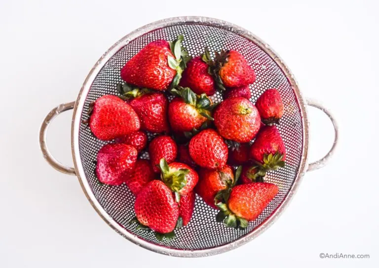 strawberries in a strainer