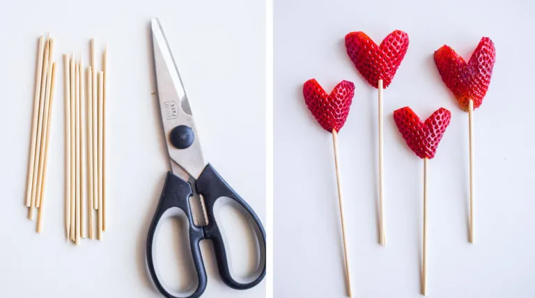 scissors, cut wooden skewers and heart shaped strawberries with skewers poked through them