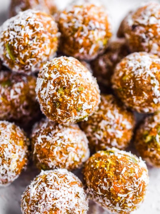 close up of carrot cake bites rolled in shredded coconut