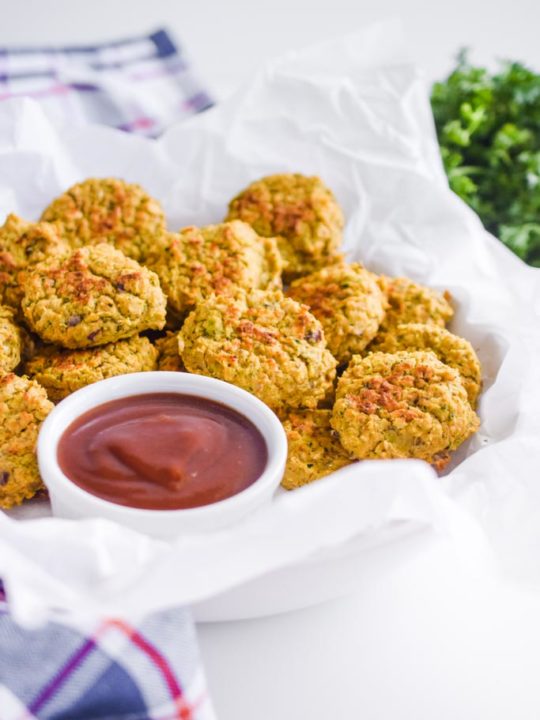 chickpea nuggets in white parchment paper with ketchup