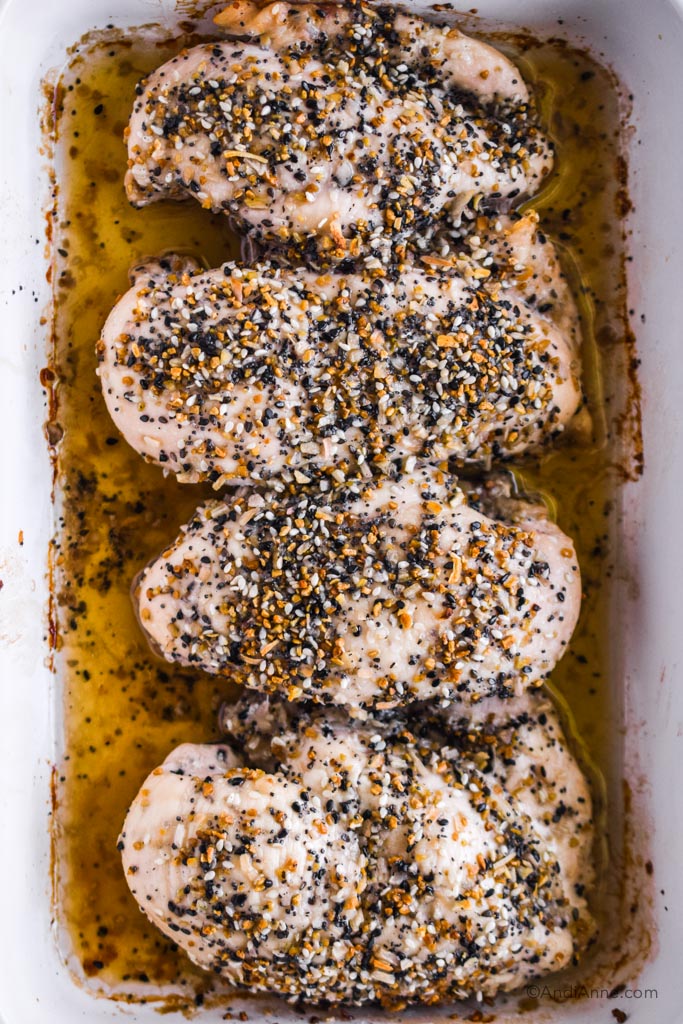 everything bagel chicken breasts in a white casserole dish