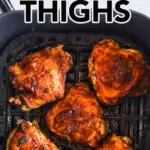 Crispy juicy air fryer chicken thighs in an air fryer basket