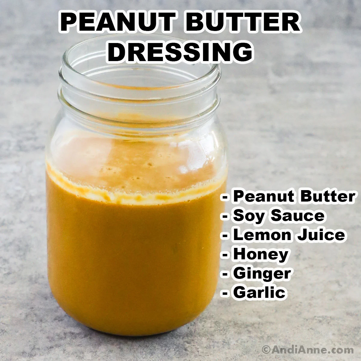 A mason jar of peanut butter dressing with ingredients listed beside including peanut butter, soy sauce, lemon juice, honey, ginger, and garlic.