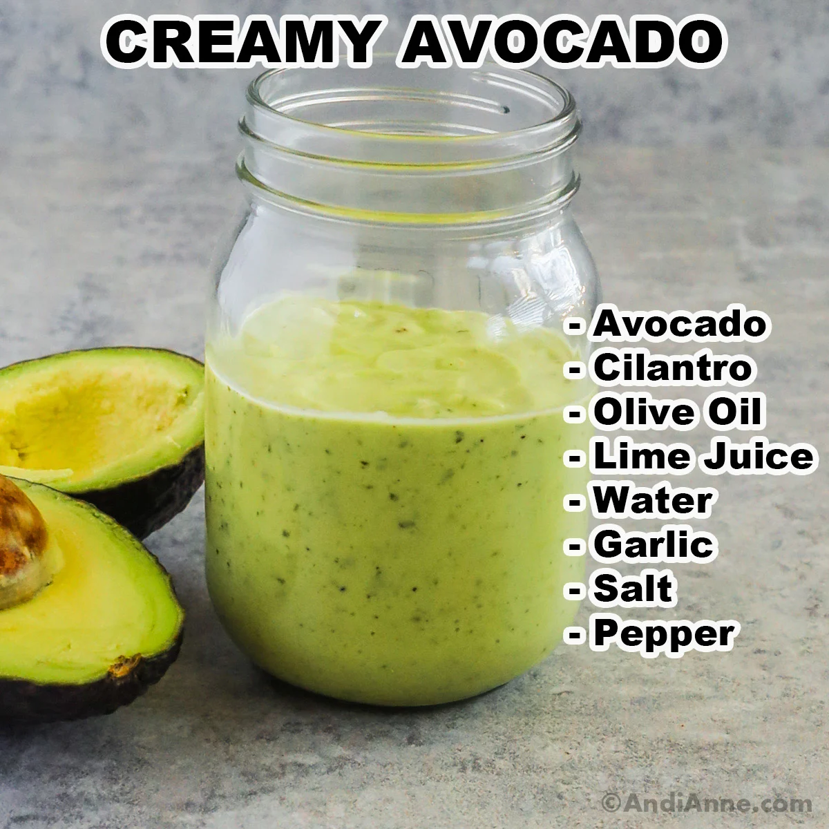 A jar of creamy avocado dressing with a sliced avocado beside it. Ingredients are listed beside include avocado, cilantro, olive oil, lime juice, water, garlic, salt and pepper.