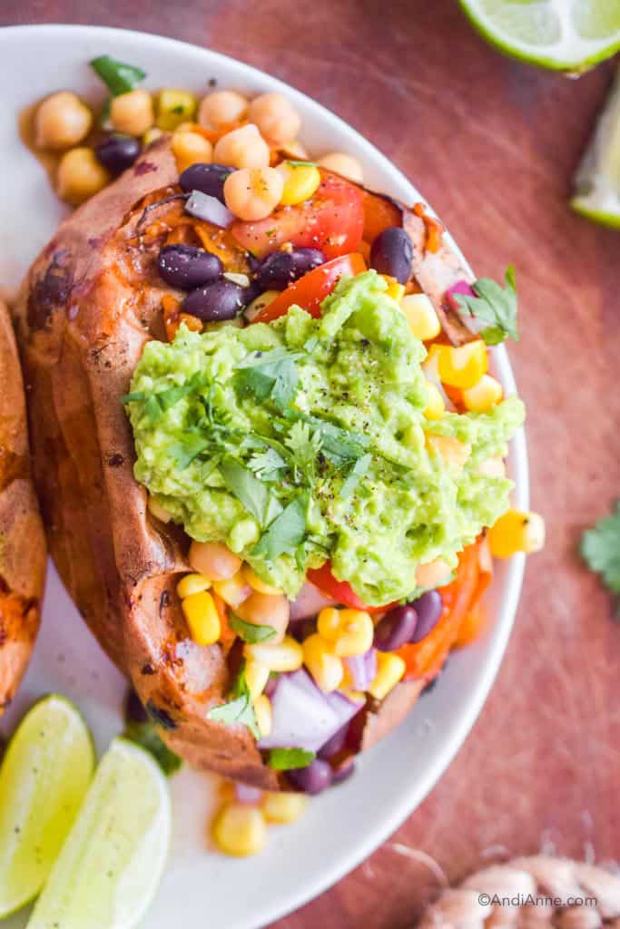 Close up detail of taco stuffed sweet potato on a white plate.