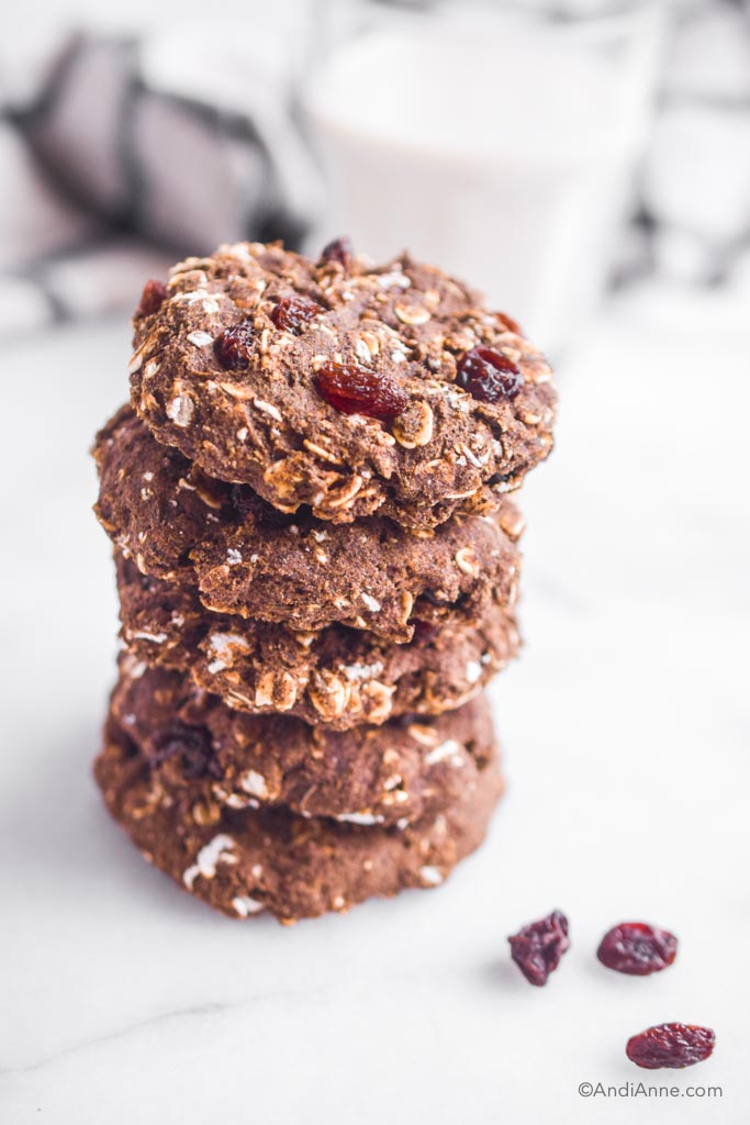 buckwheat oatmeal raisin cookies stacked on top of eachother with a white background
