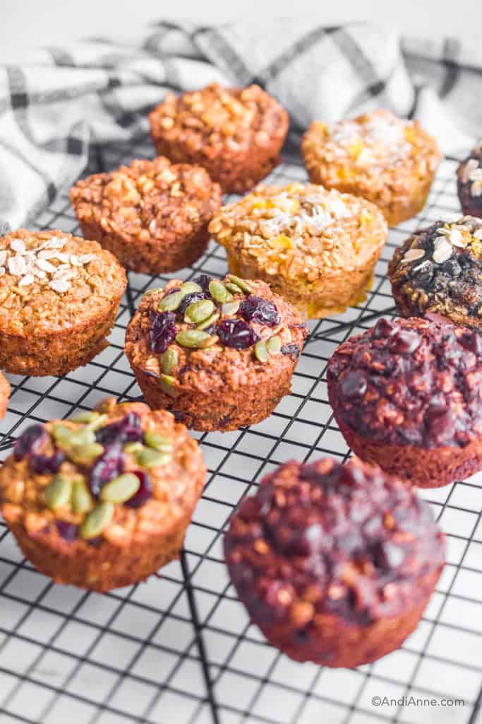 oatmeal muffins with 6 different flavors on a black cooling rack