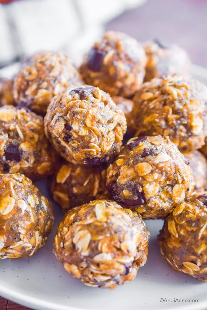 close up of pumpkin oat energy balls stacked on top of eachother