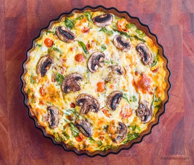 Cooked mushroom frittata in a round baking dish.