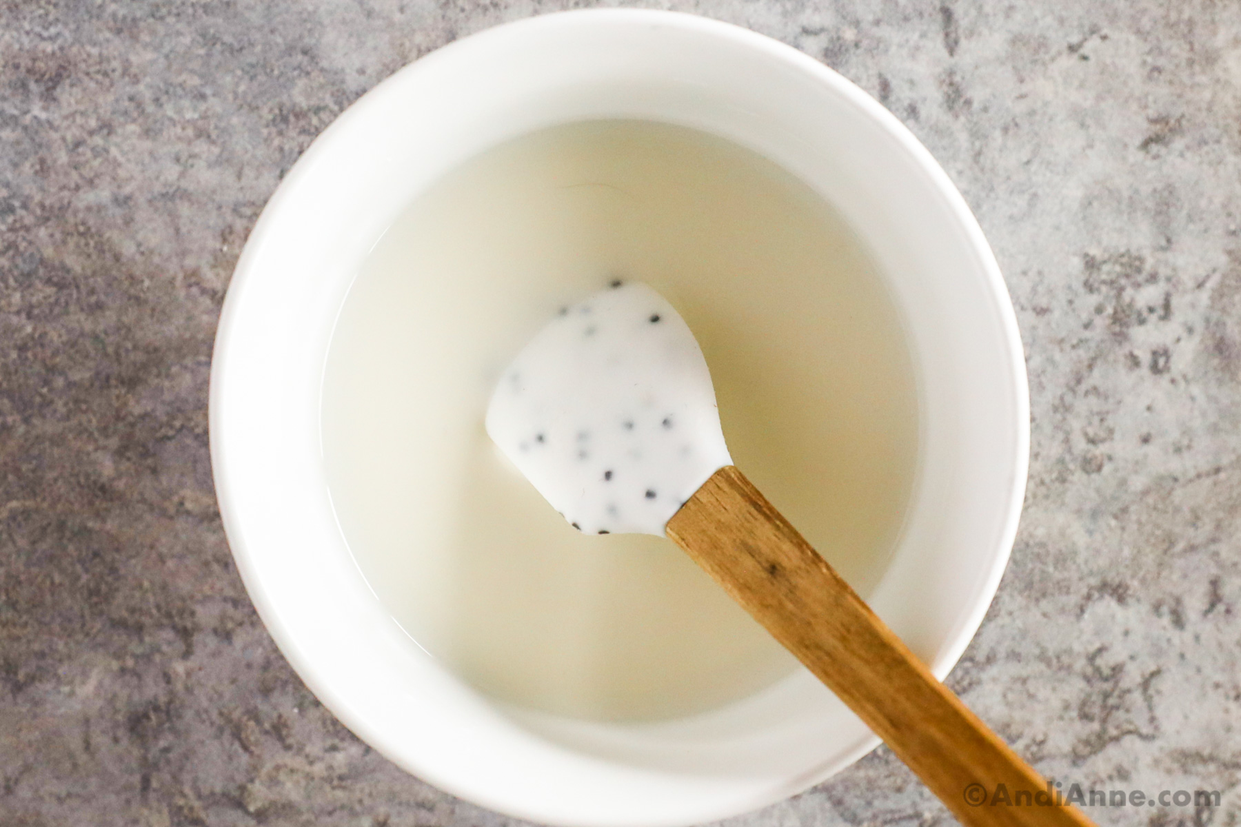 bowl of cornstarch with water and spatula