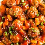 Sweet and sour meatballs on a bed of rice.