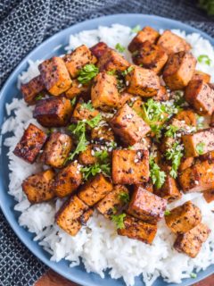 Baked tofu on a bed of rice.