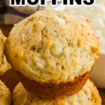 A stack of cottage cheese muffins with bowl of cottage cheese in background
