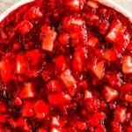 A bowl of cranberry pineapple jello salad