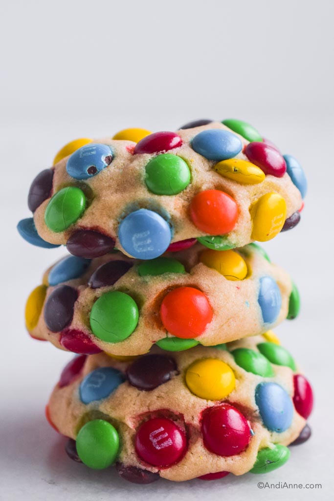 Three mini M&Ms cookies piled on top of eachother. 