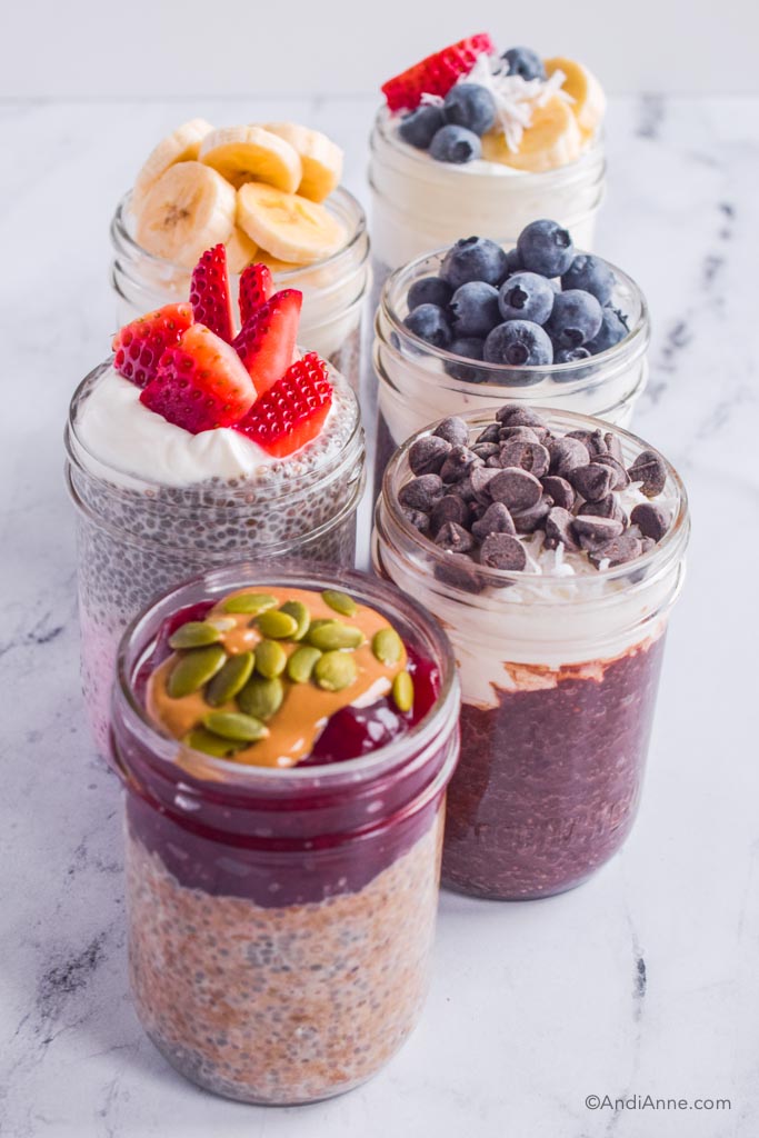 six chia pudding flavors including vanilla, peanut butter and jelly, chocolate, strawberries and cream, blueberry, and chocolate. All topped with various fruits, seeds, chocolate chips and nut butter.