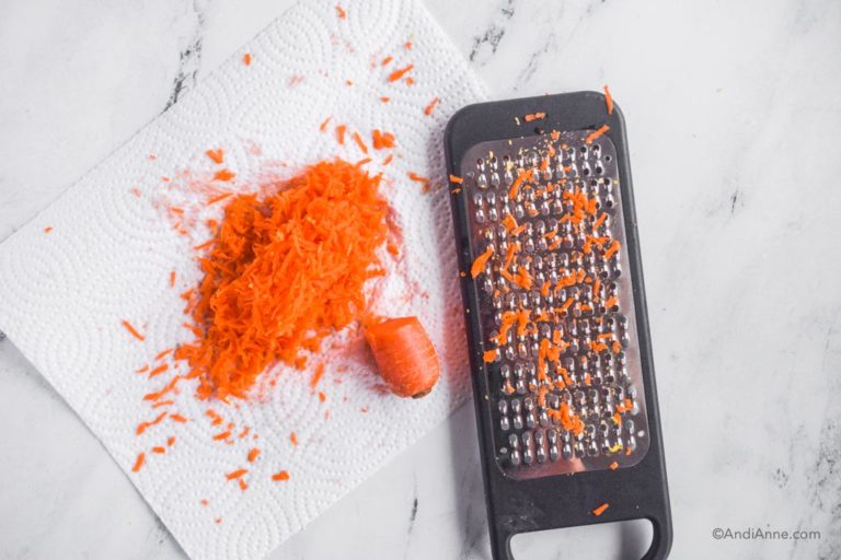 grater, shredded carrot and paper towel