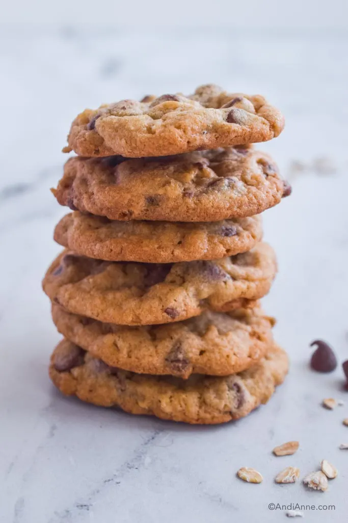 six chocolate chip oat cookies piled on top of eachother.