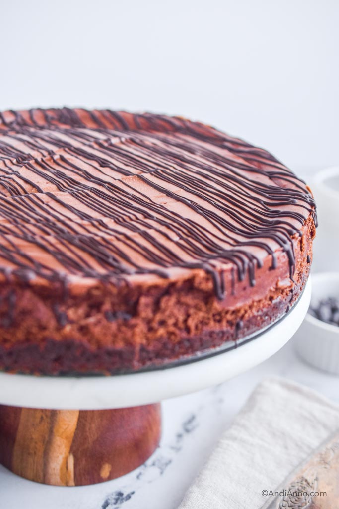 Double chocolate cheesecake on a cake stand.