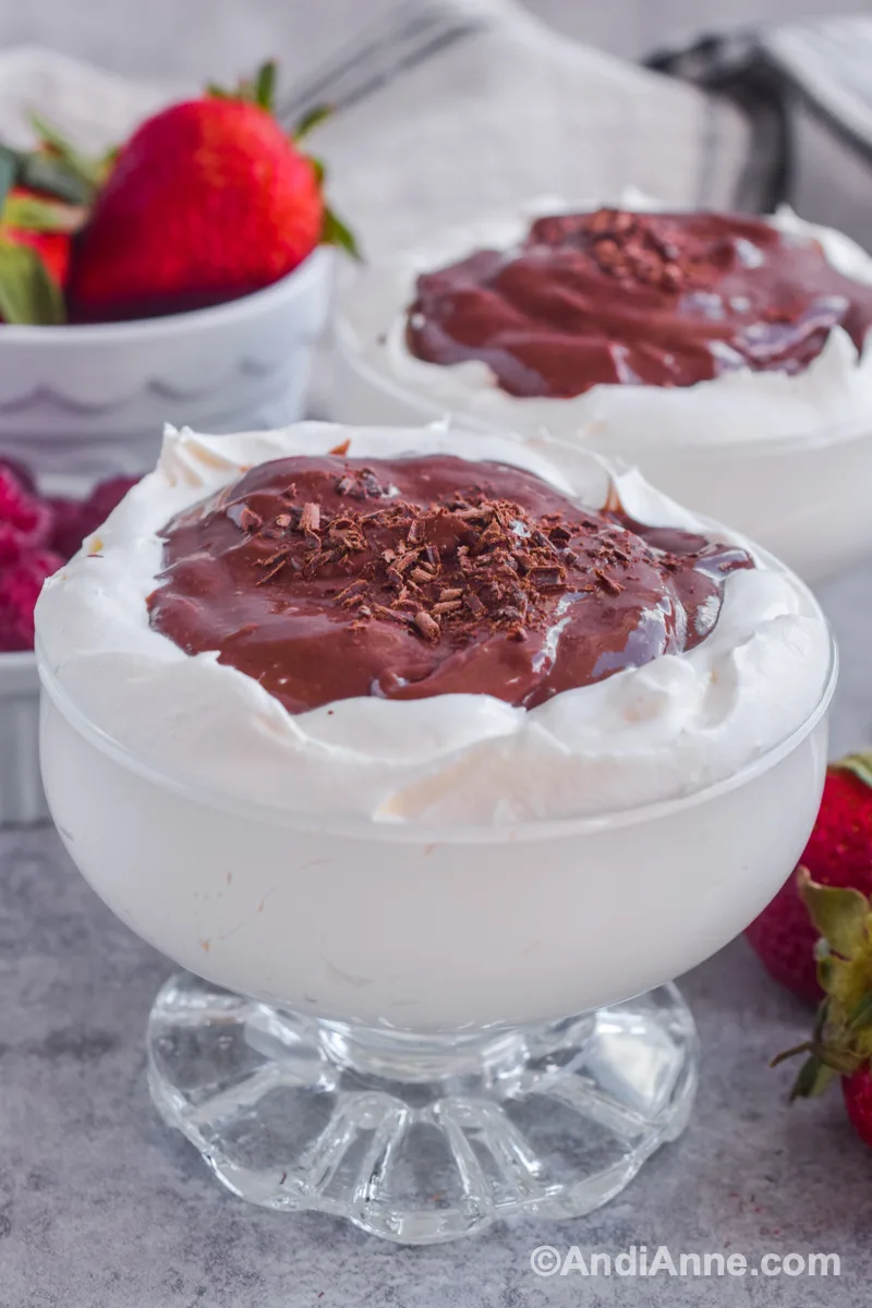 Pudding in a cloud dessert with fresh berries in background.