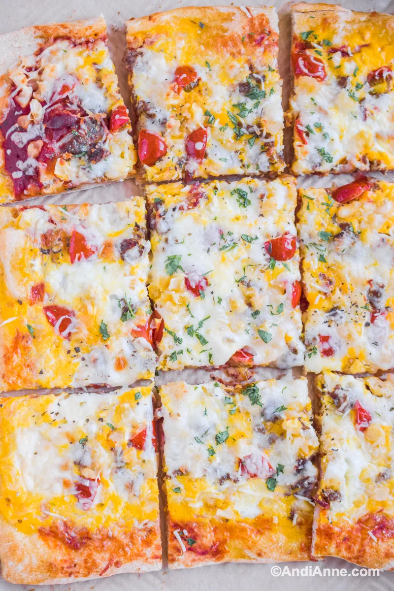 Close up of 9 slices of breakfast pizza.