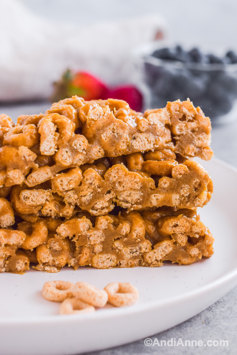 Close up of stack of cereal bars on a white plate. 