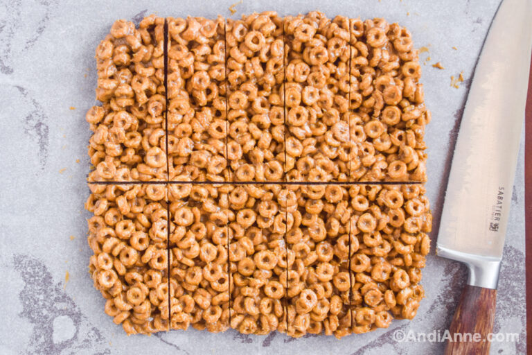 Cereal bars sliced with a knife beside them.